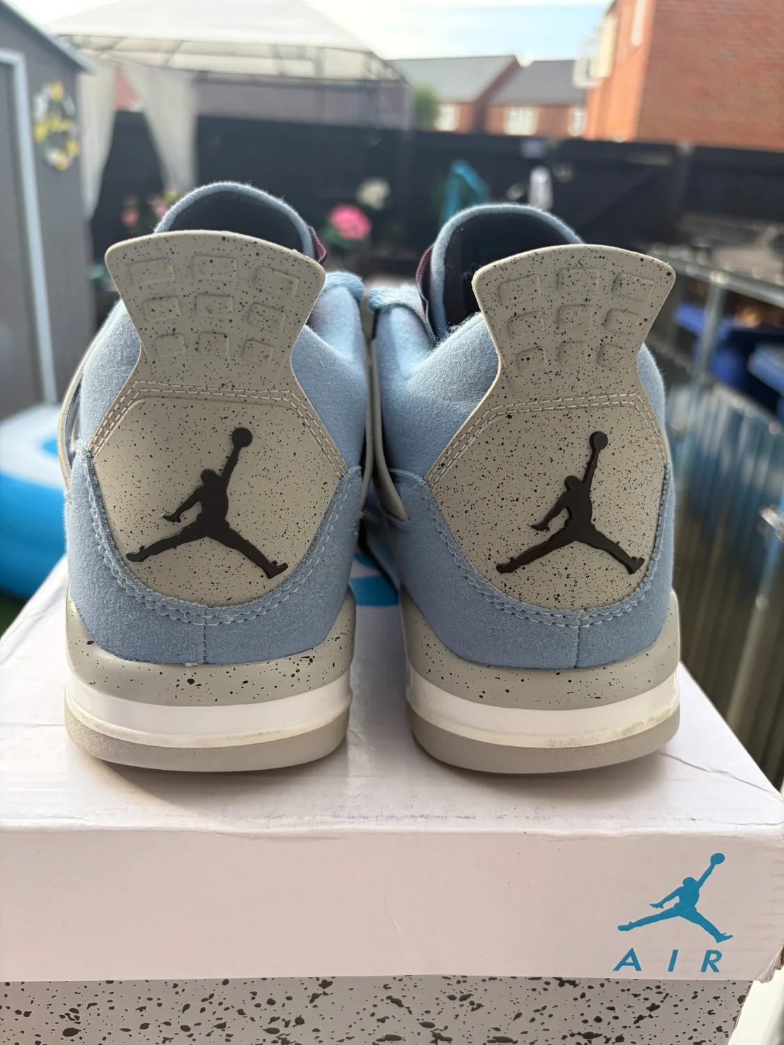Jordan 4 Retro University Blue heels